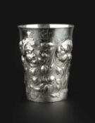 A German silver large beaker, of tapered form with slightly flared rim, embossed with flowers and
