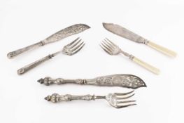 A pair of mid Victorian silver fish servers, the blade pierced and engraved with a roundel of a
