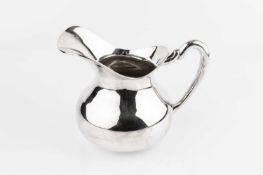A South American silver jug, of plain baluster form, stamped 0.900, 15cm high, 11.5oz