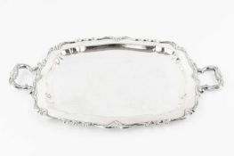 A Peruvian silver twin handled small tray, of shaped rectangular form, with foliate scroll