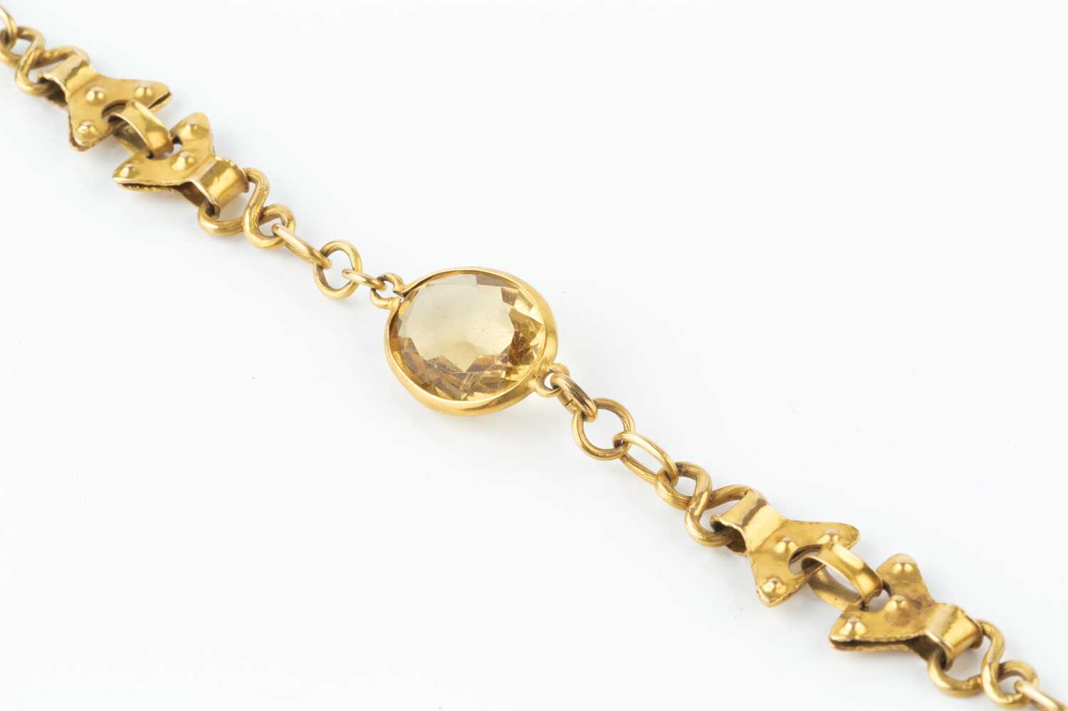 A citrine set panel bracelet, of fancy-link design, the trio of oval mixed-cut citrines in collet - Image 2 of 2