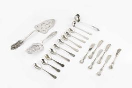 A collection of Peruvian silver flatware, comprising two pierce decorated serving slices, two
