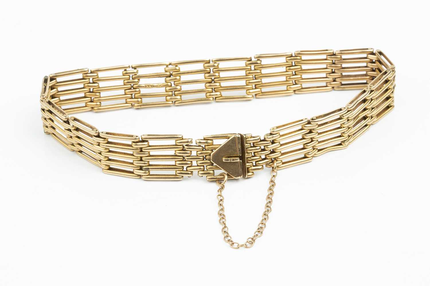 A yellow precious metal gate-link bracelet, stamped '9ct', length 18cmCondition report: General