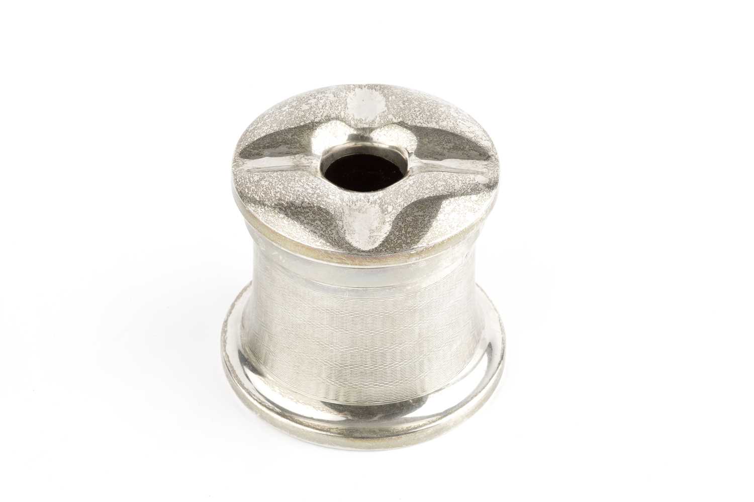 A silver no spill inkwell, of waisted circular form, with engine turned decoration, screw cover