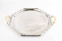 A silver twin handled tea tray, of octagonal form, with angular borders and ivory handles, by