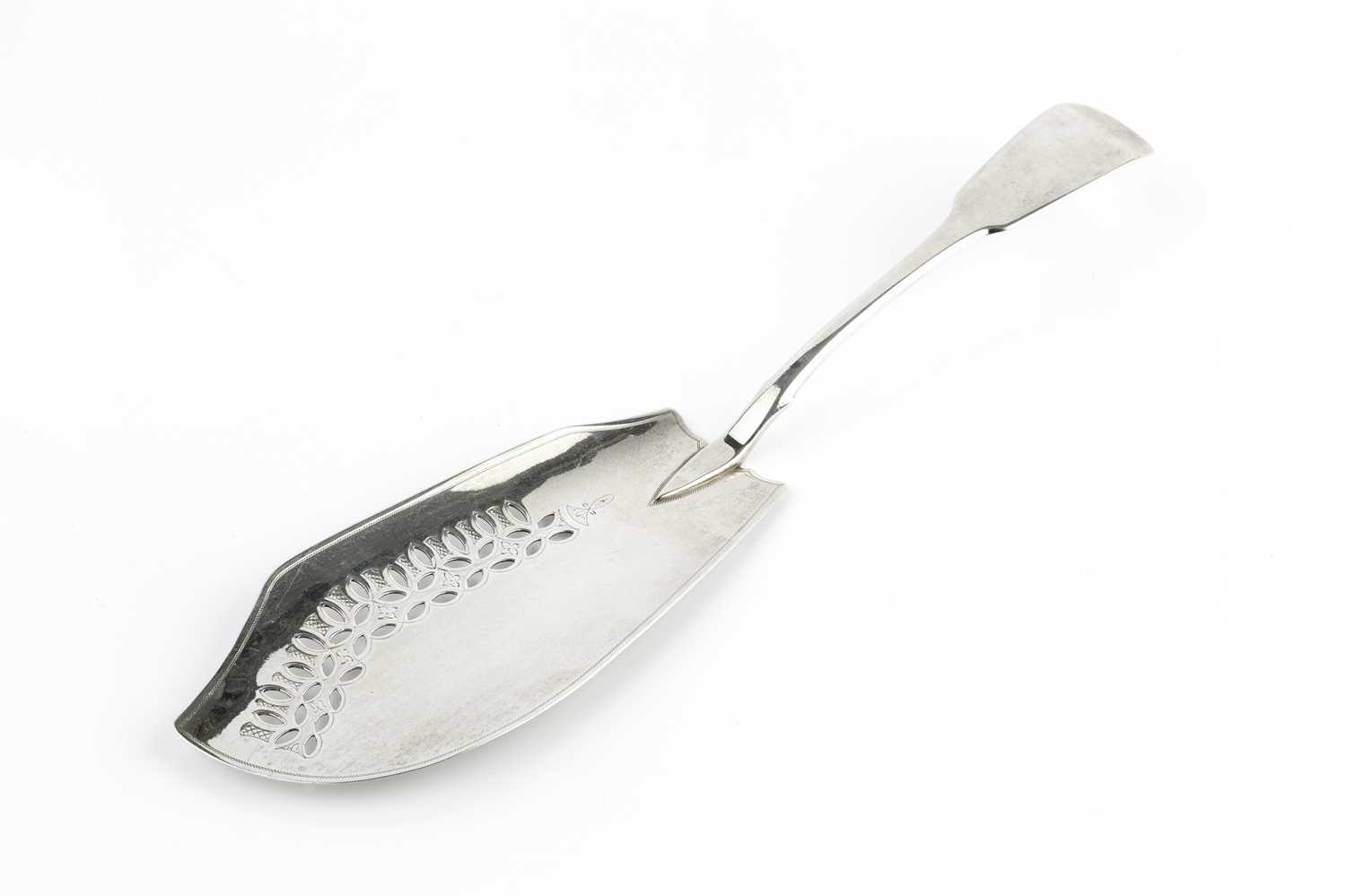 A George III silver fiddle pattern fish slice, with pierce blade, maker's mark worn, London 1810,