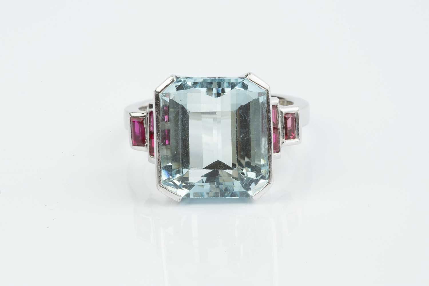An aquamarine and ruby dress ring, the octagonal step-cut aquamarine in raised part-collet - Image 2 of 3