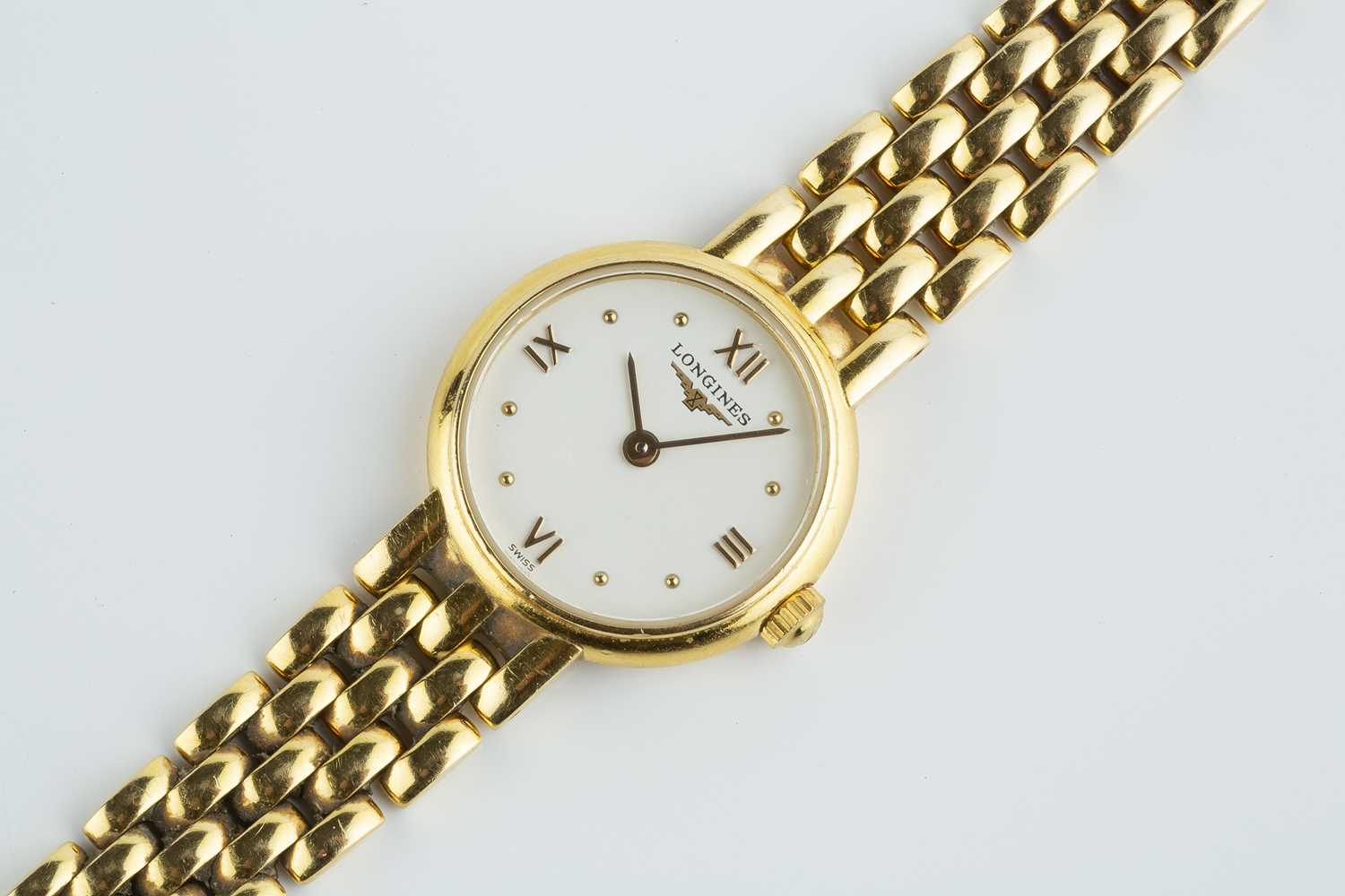 A lady's 18ct gold bracelet watch by Longines, the circular white dial with gilt Roman numeral - Image 3 of 4
