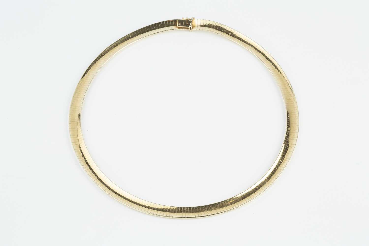 A yellow precious metal collar necklace, of gas-pipe design, stamped '585', length approximately - Image 2 of 3