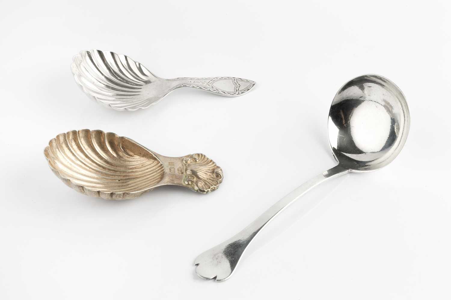 A silver caddy spoon, with scalloped bowl and bright cut handle, by Thomas Bradbury & Sons,