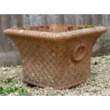 A cast square tapering terracotta planter 66cm wide x 46cm highCondition report: Weathered and