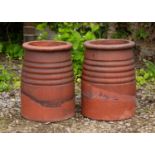 A pair of unusual terracotta 'beehive' type chimney pots 31cm diameter at the base x 40cm