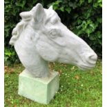 A painted cast reconstituted stone sculpture of a horses head on a square plinth, 61cm highCondition