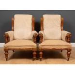A pair of Victorian oak framed armchairs with turned tapering front legs and ceramic casters, 70cm