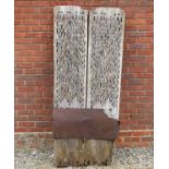 A large weathered rustic scraping board the twin wooden planks inset with flints and with pin