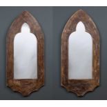 A pair of late 20th century composite wall mirrors of Gothic design, each 54cm wide x 123cm high;