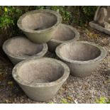 A set of five cast concrete conical planters each approximately 58cm diameter x 32cm highQty: