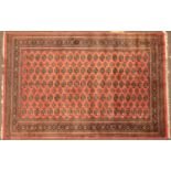 A pink ground Bokhara 'Elephant's Foot' patterned rug 283cm x 186cmCondition report: Of modern