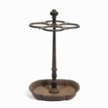 A 19th century cast iron stick stand with central fluted post supporting four oval sections, the
