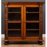 An antique rosewood glazed two door display cabinet with three shelves within, the glazed doors with