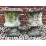 A pair of small cast reconstituted stone urns of campana form, 34cm diameter x 44cm highCondition