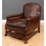 A Flemish studded brown leather upholstered walnut framed armchair 74cm wide x 85cm deep x 90cm high