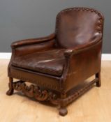 A Flemish studded brown leather upholstered walnut framed armchair 74cm wide x 85cm deep x 90cm high