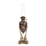 A Victorian Doulton stoneware and brass oil lamp the reservoir and body decorated by Mark V Marshall