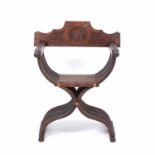 A continental walnut Savonarola chair with carved back and turned finials to the armsCondition