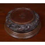 Australian interest a carved Jarrah wood plinth with turned socle, decorated with flowers, inscribed