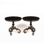 A pair of black lacquered occasional tables with gilded decoration and three scrolling legs, each