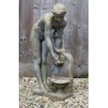 A small cast reconstituted stone sculpture of a maiden washing at a fountain, 75cm highCondition