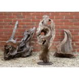 A group of three sculptural weathered tree trunk fragments, the largest 96cm highCondition report: