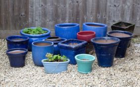 A group of fourteen blue, green and red glazed planters the largest 44cm diameterCondition report: