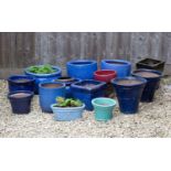 A group of fourteen blue, green and red glazed planters the largest 44cm diameterCondition report: