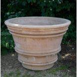 A large Cretan terracotta planter with ribbed decoration, 114cm diameter x 80cm high Condition