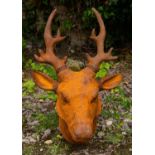 A decorative cast iron sculpture of a deer's head for wall mounting, 41cm wide x 63cm