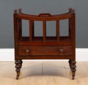 A Regency mahogany canterbury with four divided sections, brass stringing, drawer and on turned feet