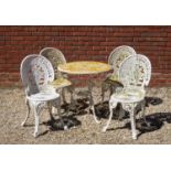 A cast aluminium garden table and four matching chairs69cm diameter x 68cm highQty: 5Condition