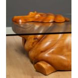 Derek Pearce (20th century school) 'The Hippo Table', carved wood and glass on casters, signed to