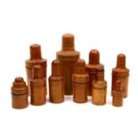 A group of ten 19th century and later turned boxwood bottle cases with screw lids, seven with