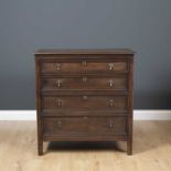 A 17th century style oak chest of drawers, the four graduated drawers with drop handles and standing