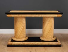 An ebonised and wicker woven twin pedestal rectangular centre table, 114.5cm long x 50cm wide x 71.