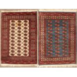 A modern blue ground Baluchi rug with three rows of medallions within a multiple banded border,