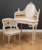 An early 20th century white painted kidney shaped dressing table with raised back with inset oval