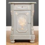 A grey painted bedside cabinet with faux marble painted top, single drawer over a cupboard and