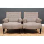 A pair of modern low armchairs upholstered in grey herringbone material, with scrolling arms and