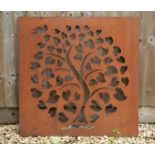 A pierced steel panel depicting a bird flying above a tree in full leaf, 91.5cm wide x 90cm