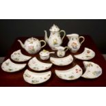 A Herend porcelain tea and coffee service consisting of teapot, coffee pot, hot water jug, milk jug,