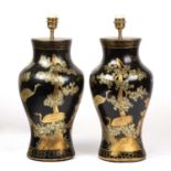 A pair of black lacquered papier-mache table lamps of baluster form with chinoiserie decoration,